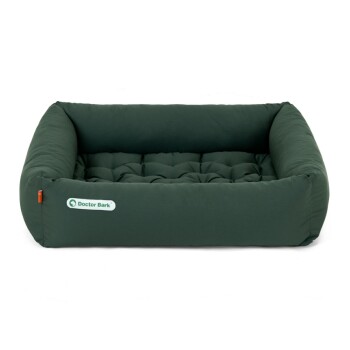 Grünes Haustierbett mit gepolstertem Design, das ein Logo mit der Aufschrift 'Doctor Bark' zeigt.