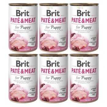 Sześć puszek Brit Paté & Meat dla szczeniąt, z różowym i białym wzorem, podkreślających roszczenia "Bez zbóż" i "Bez soi i GMO."