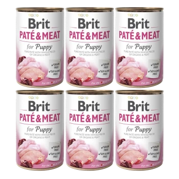 Sechs Dosen Brit Paté & Meat für Welpen, mit einem pinken und weißen Design, das die Ansprüche 'Getreidefrei' und 'Soja- & GMO-frei' hervorhebt.