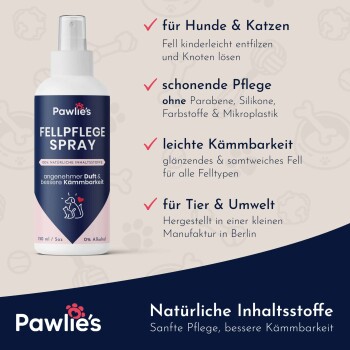 Ein schlafender Welpe und Kätzchen kuscheln sich unter einer blauen Decke neben einer Flasche Pawlie's Fellpflege Spray für stressfreies Grooming.