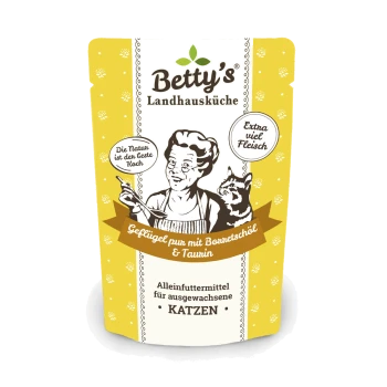 Die Verpackung von Betty's Landhausküche Katzenfutter zeigt einen Koch und eine Katze, mit Text über Geflügel, Borretschöl, Taurin und Katzenfutter für Erwachsene.