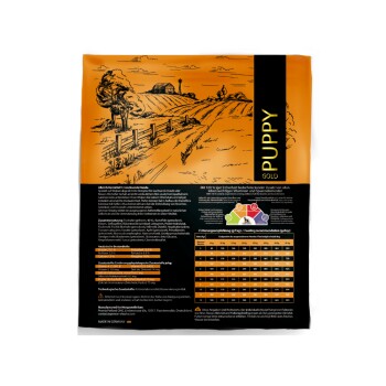 Hunde-Futterbeutel Puppy Gold mit einem orange-schwarzen Design, mit einer ländlichen Illustration und detaillierten Nährwertinformationen auf der Rückseite.