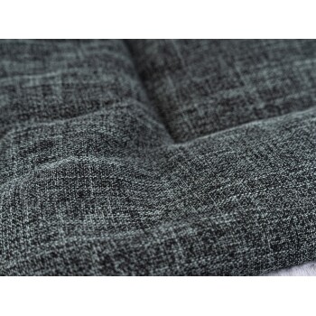 Nahaufnahme eines strukturierten, dunkelgrauen Haustierbettstoffs, der seine weiche, gewebte Oberfläche zeigt.