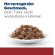 Hundefutter in einer weißen Schüssel, mit der Aufschrift 'Hervorragender Geschmack, dem Tiere nicht widerstehen können'.