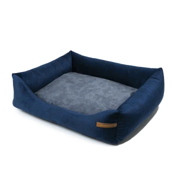 Marineblaues Haustierbett mit erhöhten Seiten und einem weichen grauen Zentrum, mit einem kleinen braunen Etikett an der Seite.