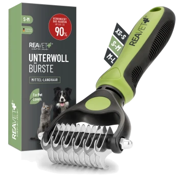 Zweiseitige Unterwollbürste mit ergonomischem schwarz-grünem Griff, in einer Box beschriftet mit "REAVET Unterwoll Bürste," behauptet, das Haaren um 90% zu reduzieren.
