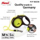 Neon yellow and black flexi retractable dog leash with ergonomic grip, 5m tape for dogs up to 25kg, and accessory slot.