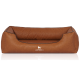 Braunes Hundebett mit einem weichen, gepolsterten Design und schwarzem Rand, mit dem Logo "KNUFFELWUFFF" auf der Vorderseite.