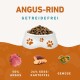 Angus-Rindfleisch-Hundefutter in einer Schüssel, beschriftet mit 'GETREIDEFREI', mit 50 % Angus, 26 % Süßkartoffel und Gemüse.