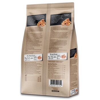 Hundefutterverpackung featuring eine getreidefreie Formel mit Hähnchenfilets, Nährwertinformationen und Fütterungshinweisen in Deutsch und Englisch.