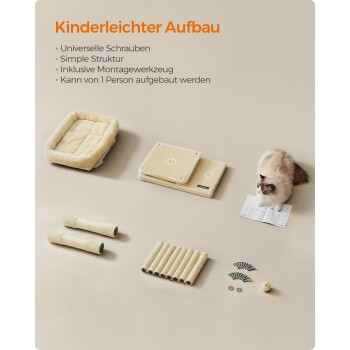 Eine flauschige Katze sitzt neben einem Haustierbett-Kit mit Kissen, Werkzeugen, Schrauben und einem Handbuch mit der Aufschrift "Kinderleichter Aufbau."