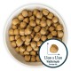 Bowl filled with small, round pet food kibble, average size 1.1cm x 1.1cm, showcasing a light brown color.