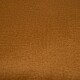 Eine Nahaufnahme eines strukturierten, warmbraunen Stoffes, geeignet für Haustierbettwäsche oder Zubehör.