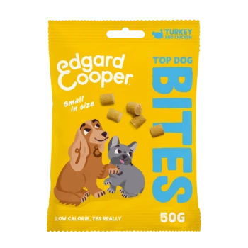 Verpackung von Edgard Cooper Top Dog Bites Haustierleckerlis, mit einem verspielten Hund und einer Katze, mit Text, der 'klein in der Größe' und 'kalorienarm' hervorhebt.