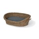 Woven pet bed with a natural fiber exterior and a dark gray cushion inside, featuring two handles for easy transport.
