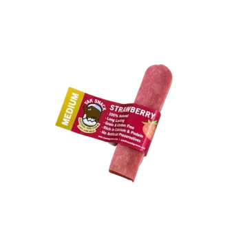 Pink strawberry yak snack dog chew bar labeled "MEDIUM" and "STRAWBERRY."