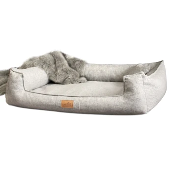 ® Orthopädisches Hundebett GOOFY Couture >> inkl. Matratzenschoner << grau/ grau 90 cm, 25 cm, 75 cm Graues rechteckiges Haustierbett mit erhöhten Seiten und einer Kunstfell-Decke, vorne mit der Aufschrift „teriando“.