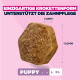 Croquette hexagonale brune pour chiot ; texte «EINZIGARTIGE KROKETTENFORM UNTERSTÜTZT DIE ZAHNPFLEGE» (forme de croquette unique, favorise le soin des dents) ; dimensions 7,0 mm et 11,0 mm ; PUPPY S M L XL.