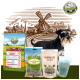 Ein Schnauzer steht neben Bellfor Haustierfutterprodukten, einschließlich Trockenfutter, Snacks und einem "SHIIMUN SKIN" Beutel, mit einer Windmühlenkulisse.
