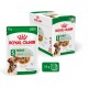 Royal Canin mini adult dog food packaging, featuring an 85g pouch and a box of 12, with a dog image and nutritional claims.