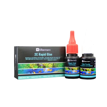Silbermann 2C Rapid Kleber-Set mit roter "Rapid Glue" Flasche, weißer "White Powder" Flasche und einer Box mit aquatischen Bildern und mehrsprachigem Text.