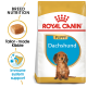 Royal Canin Puppy Dachshund dog food bag featuring tailored kibble and claims for breed nutrition and immune system support.