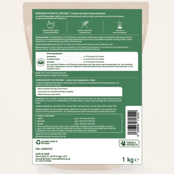 Ergänzende Flocken für Hunde, mit natürlichen Zutaten wie Gemüse und Kräutern. Nährwertinformationen und Fütterungshinweise sind enthalten.