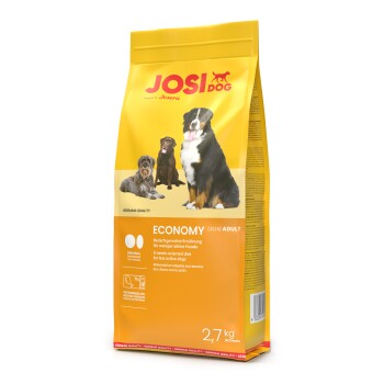 Gelbe Tüte JosiDog Economy Adult Hundefutter mit Bildern von drei Hunden und Text in Deutsch, Englisch und Französisch.