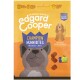 Edgard Cooper Champion Huhn Bites Hundeleckerlis Verpackung mit einer Cartoon-Hund, Heidelbeeren und Apfelillustrationen, mit Text auf Deutsch.