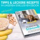 Ebook-Cover mit dem Titel 'Die Arbeit mit der Schleckmatte', das einen Hund und eine Katze zeigt, umgeben von Hafer, Bananen, einem Apfel und Leckereien.