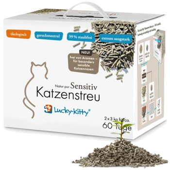 Schachtel Lucky-Kitty Sensitiv Katzenstreu mit der Aufschrift 'ökologisch, geruchsneutral, 99% staubfrei', mit Pellet-Haufen und einem Keimling.