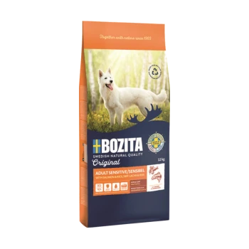Bozita Hundefuttertüte, 12 kg, mit einem weißen Hund vor einem Waldhintergrund. Der Text hebt 'Adult Sensitive/Sensibel' mit Lachs und Reis hervor.
