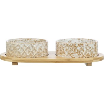 Keramische Futterschalen für Haustiere mit geometrischem Muster, auf einem Holzuntergrund, entworfen für die Fütterung von Hunden oder Katzen.