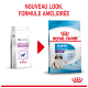 Image de deux sacs de nourriture pour chiots Royal Canin : "Pediatric Puppy Giant Dog" et "Puppy 2-8 months Giant," avec une flèche rouge pour un nouveau look.