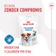 Verpakking van Royal Canin Training Treats met een blije hond, met tekst die zegt 'Minder dan 3 calorieën per stuk' en 'Zonder compromis.'