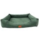 Grünes Haustierbett mit erhöhten Rändern und einer weichen, gerippten Textur, mit einem kleinen braunen Etikett auf der Vorderseite.