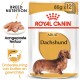 Royal Canin Adult Dachshund hondenvoer verpakking, met een gouden label, voedingsclaims en een visueel van de voedseltextuur.