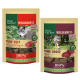 Zwei Real Nature Wilderness Tierfutterverpackungen: 'Reines Rind' mit einem Wolfbild und Oregano, und 'Reines Pferd' mit einem anderen Wolf. 100% Fleischsnacks.