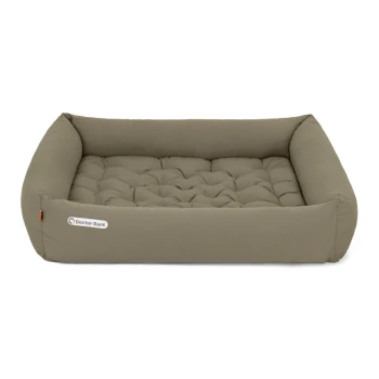 Ein plüschiges, rechteckiges Haustierbett in neutralem Taupe mit gepolstertem Bezug und kleinem "Doctor Bark"-Logo an der Seite.