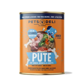 Dosenfutter für Hunde "Pute" mit Quinoa, Brokkoli und Karotte. Etiketten: "Für ein gesundes Wachstum," "Junior 2-12 Monate," "Premium Nassfutter."