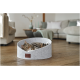 Tabby cat lounging in grey felt round pet bed with leather patch reading more on wooden floor in living room