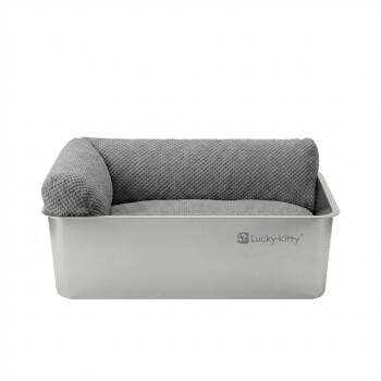 Rechteckiges Katzenbett aus Edelstahl mit grauem, strukturiertem Kissen und linkem Seitenpolster, 'Lucky-Kitty'-Logo auf der Vorderseite.