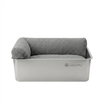 Rechteckiges Katzenbett aus Edelstahl mit grauem, strukturiertem Kissen und linkem Seitenpolster, 'Lucky-Kitty'-Logo auf der Vorderseite.