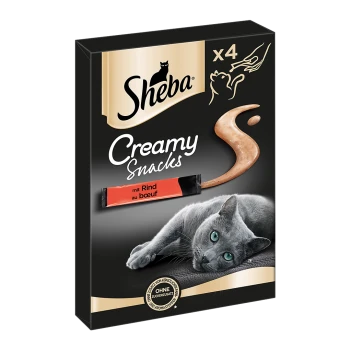 Sheba Creamy Snacks Verpackung mit einer grauen Katze, die liegt, mit einem cremigen Snack-Wirbel und dem Text "mit Rind au boeuf" auf der Vorderseite.
