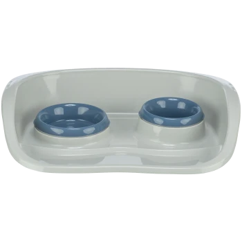 Station d'alimentation pour animaux en plastique blanc avec deux bols bleus amovibles pour nourriture et eau.