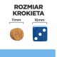 Obraz porównujący rozmiar krokieta dla zwierząt (11 mm) obok niebieskiej kostki do gry (16 mm), z tekstem "ROZMIAR KROKIETA" powyżej.