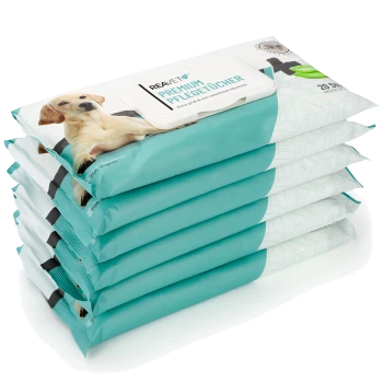 Stapel von türkisfarbenen Verpackungen für "REAVET Premium Pflege-Tücher" Tierfeuchttücher, mit einem Labrador-Welpen auf der Vorderseite, mit 20 Tüchern pro Packung.