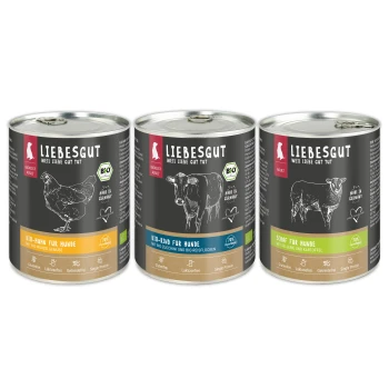 Drei Liebesgut-Dosen Hundefutter (Huhn, Rind, Schaf) mit schwarzen Etiketten, die Tierskizzen und das 'BIO'-Logo zeigen.