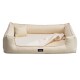Ein cremefarbener Haustierbett mit erhöhten Seiten und einem kleinen passenden Kissen, mit einem schwarzen Etikett mit dem Markennamen "tierlindz."