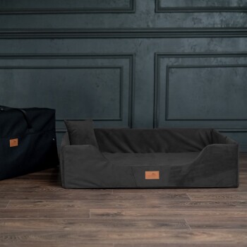 Schwarze Haustiertragetasche mit Reißverschluss und Griff, entworfen für den Transport von Haustieren.